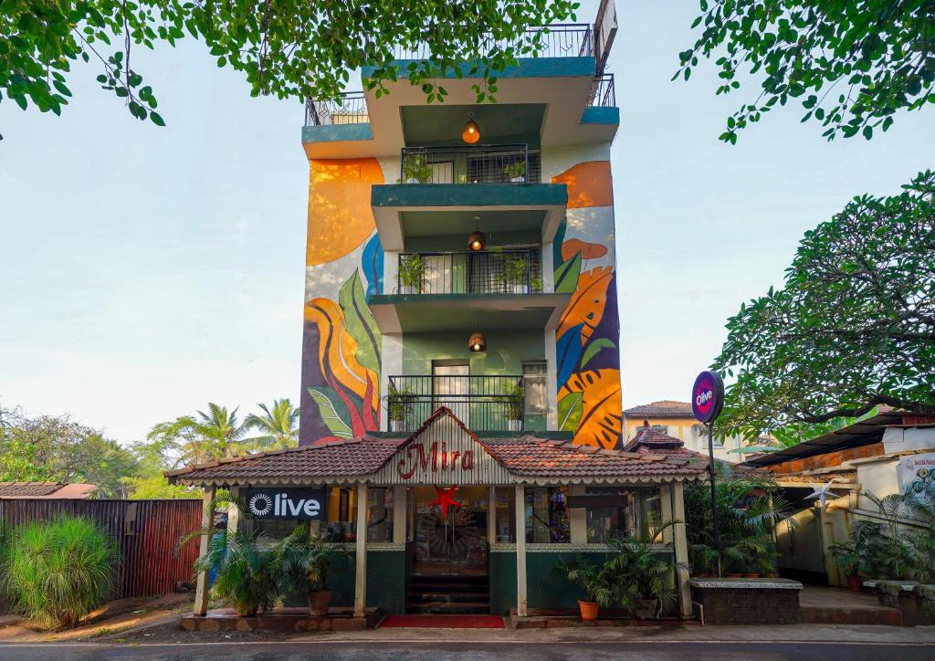 a building with a restaurant in front of it at Olive Zip Calangute Mira by Embassy Group in Calangute