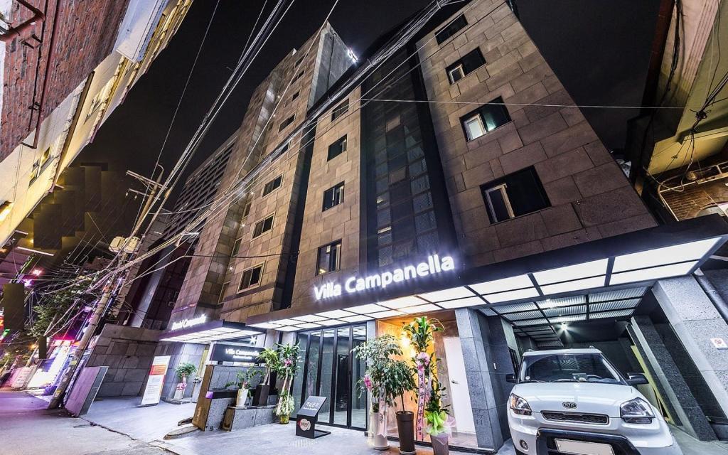 a building with a car parked in front of it at Hotel Campanella in Seoul
