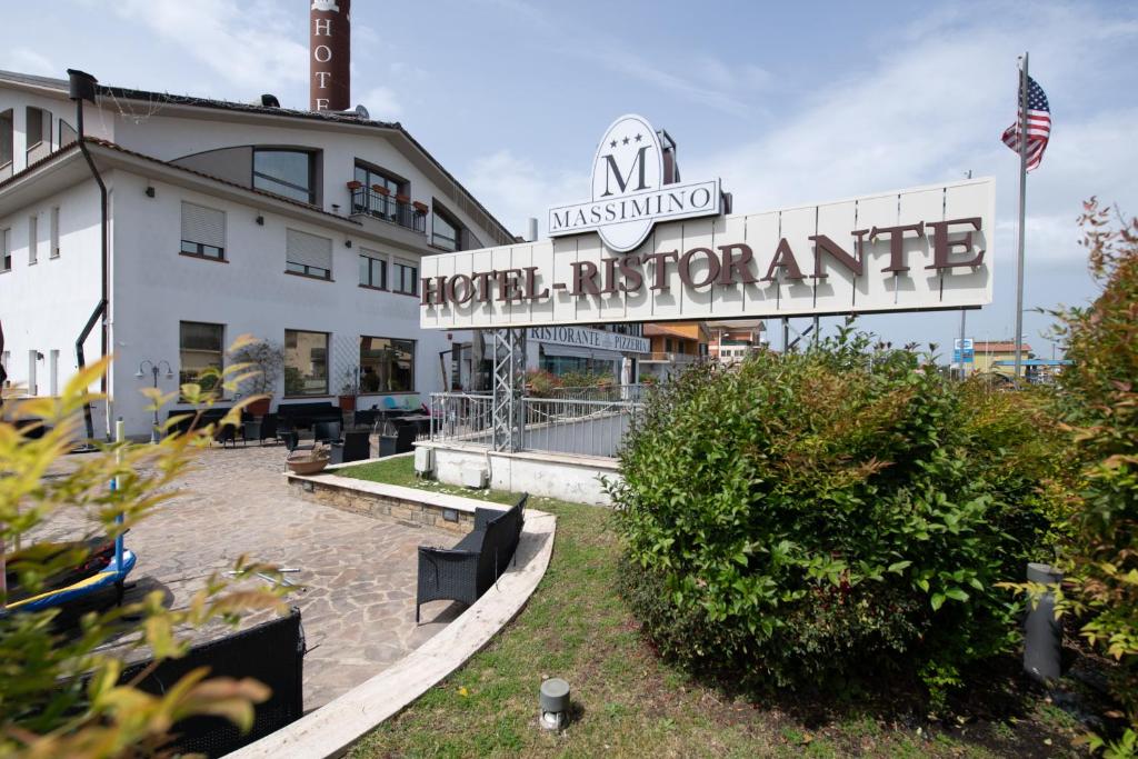 a building with a sign for the north rotunda at Hotel Massimino in Anguillara Sabazia