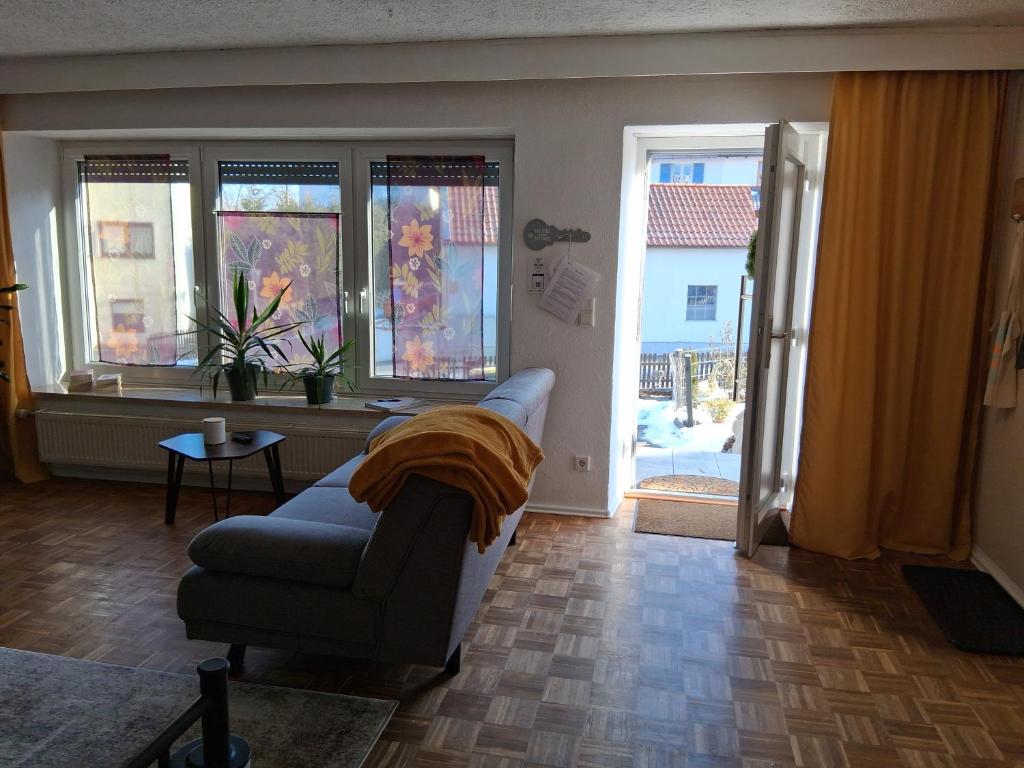 a living room with a couch and a window at Apartment Aigner in Reisbach
