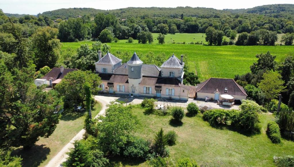 an aerial view of a large house in a field at Château La Barge - Dordogne in La Boissière-dʼAns