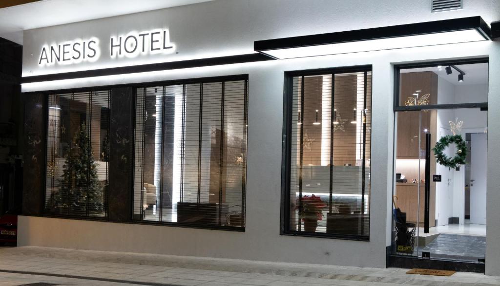 a store front with windows in a building at Anesis Hotel in Kozani