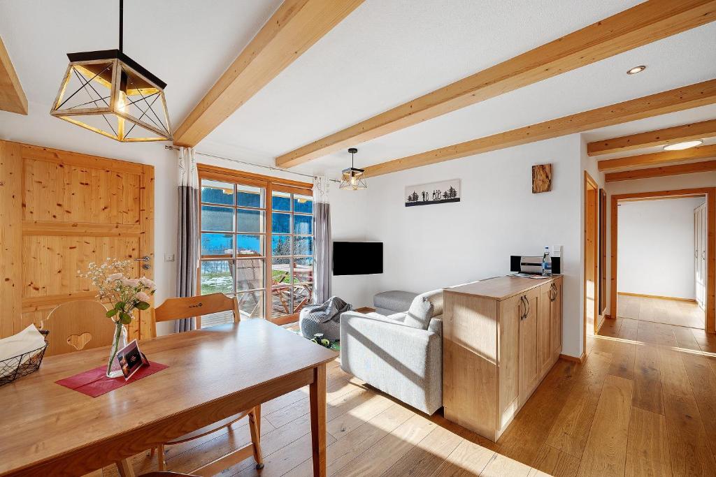 a living room with a couch and a table at Ferienwohnung Holzfäller in Lenzkirch