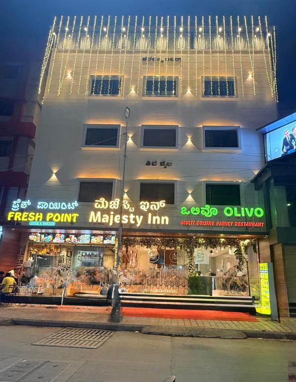 a store front of a building with lights above it at Majesty inn in Bangalore