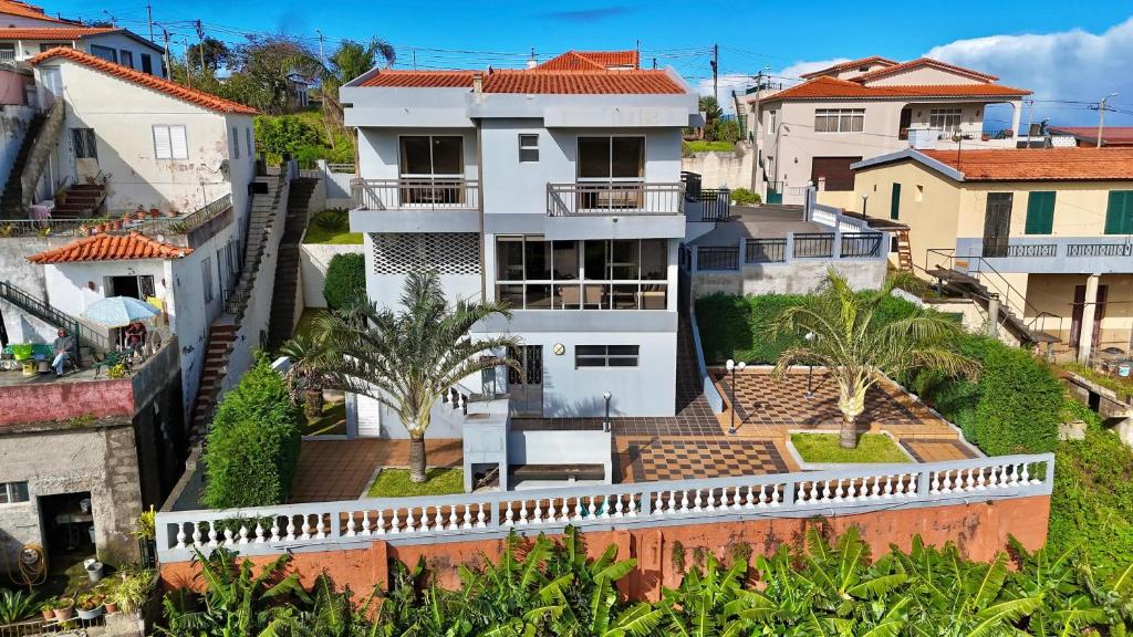an aerial view of a house in a city at The Gray House in Bicas