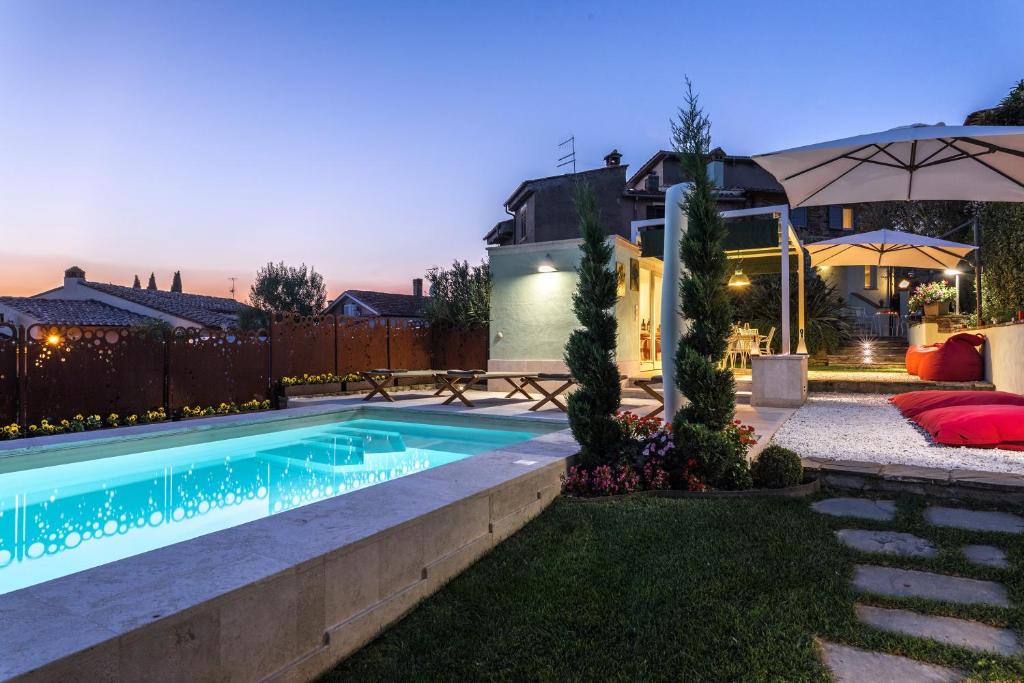 a swimming pool in the yard of a house at Il Nido 2&2 in Staggiano