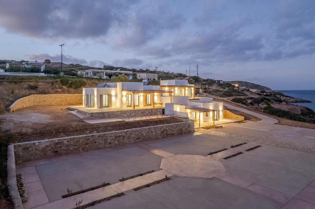 an aerial view of a house with the ocean at Lipsi Grand Villas in Leipsoi
