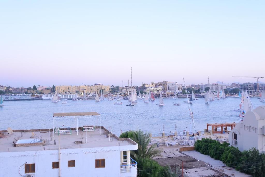 a view of a harbor with boats in the water at Qasr El Nil in Luxor