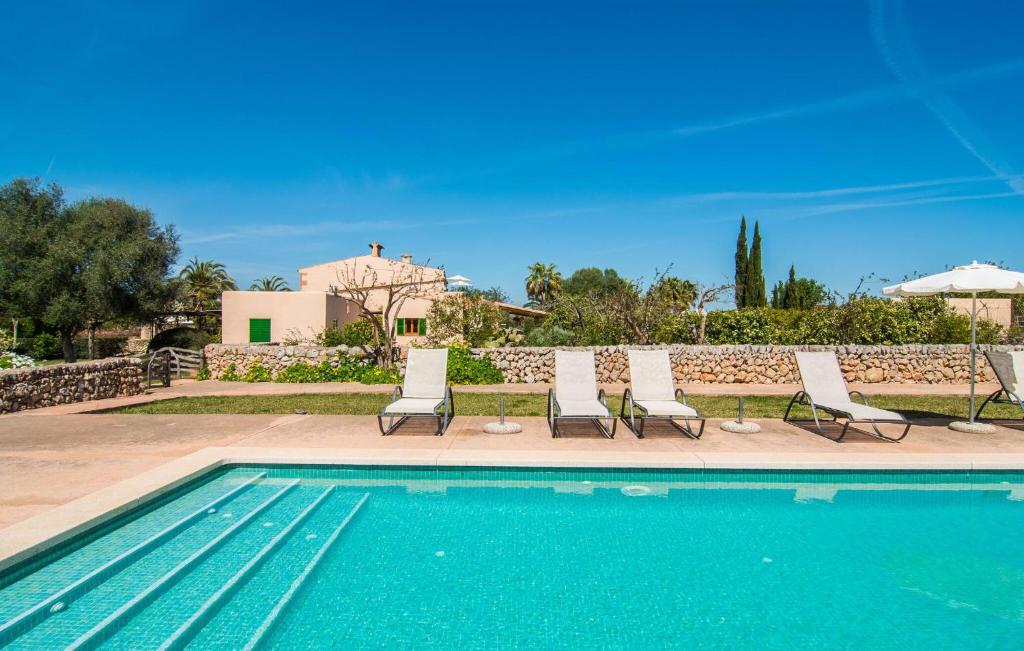 a group of chairs and a swimming pool at Son Capellot Dos in Felanitx