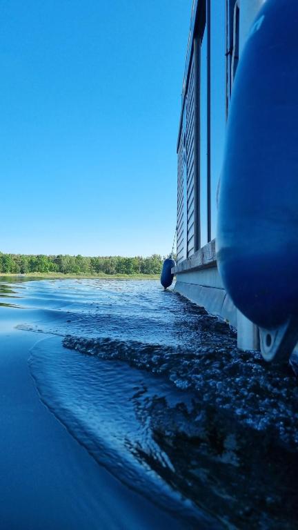 a view of a river from a train at Hausboot Havelrobbe in Brandenburg an der Havel