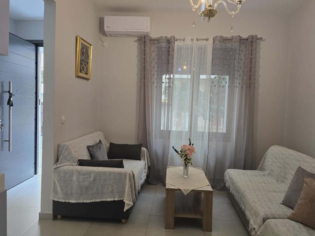 a living room with a couch and a table at A&A Apartment in Piraeus