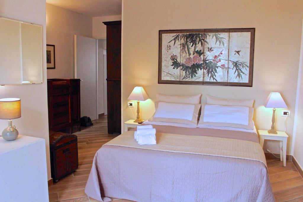 A bed or beds in a room at La Piccola Corte Malpensa, 8 minuti d'auto