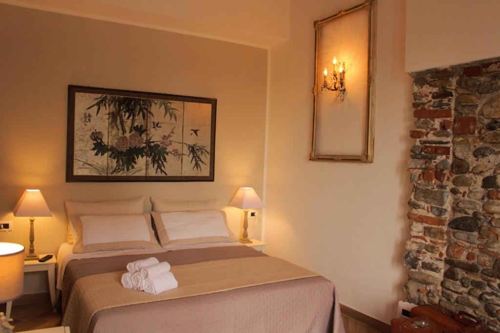 A bed or beds in a room at La Piccola Corte Malpensa, 8 minuti d'auto