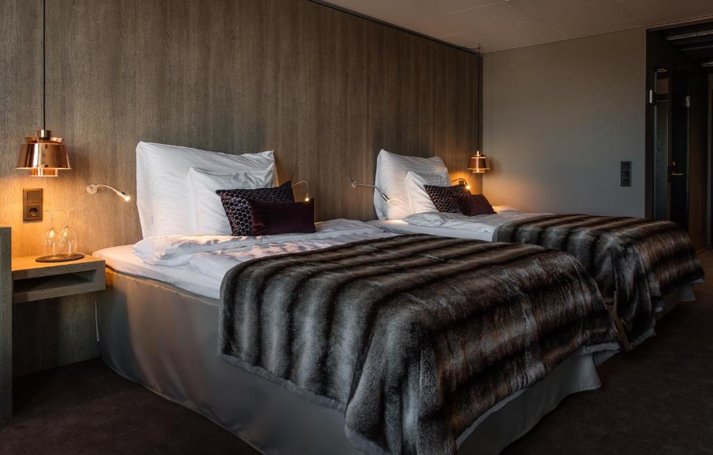 Postel nebo postele na pokoji v ubytování KUST Hotell & SPA