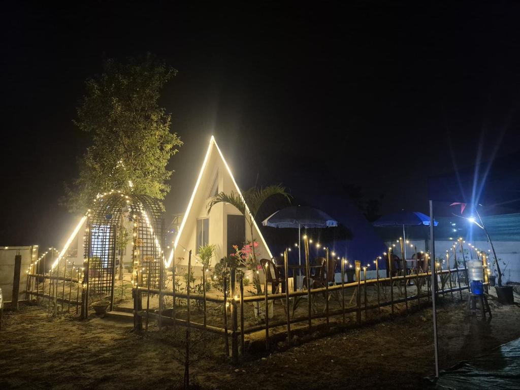 a church lit up at night with lights at Mung Kham Stays in Jorhat