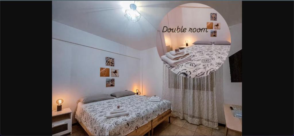 a small bedroom with a bed and a mirror at Le2sorelle in Ancona