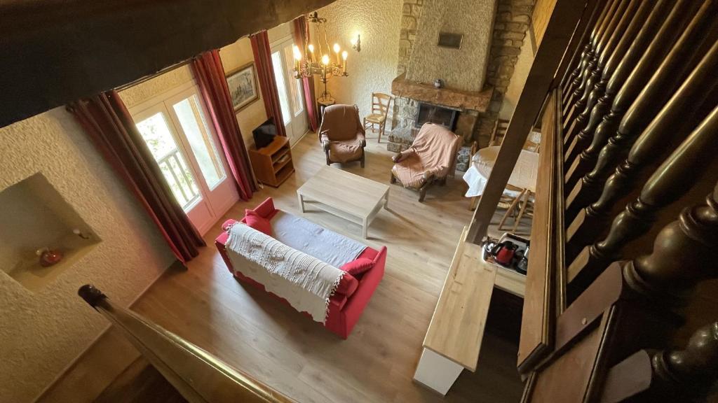 an overhead view of a living room with a couch and chairs at Gîtes de la Ferme Basso in Planès