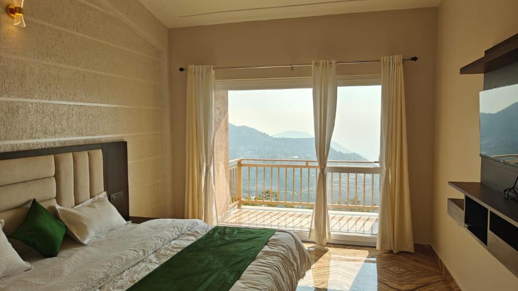 a bedroom with a bed and a large window at Dual Lake in Bhīm Tāl