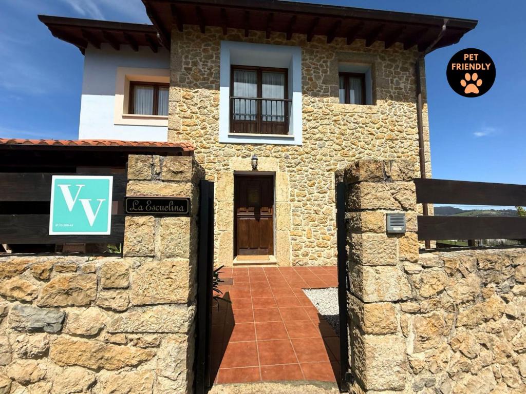 a stone house with a sign in front of it at Casa La Escuelina en Villanueva VV-2999-AS in Villanueva