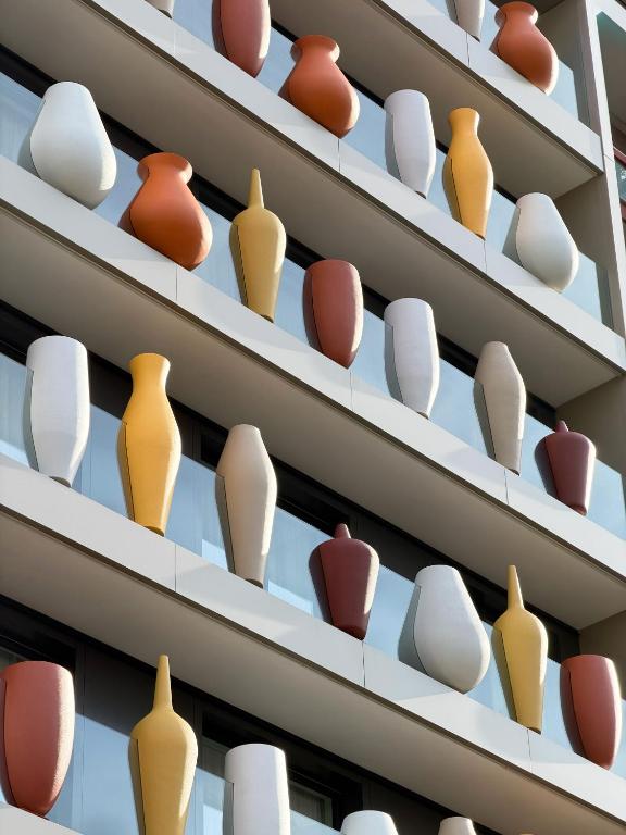 a display of pots and vases on shelves at Palazzo Le Giare - Luxury Apartments in Bari