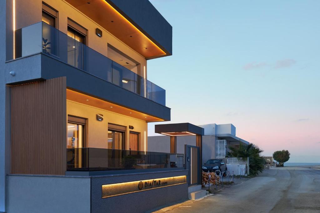a building with a view of the ocean at Diastar Luxury Suites NEW in Heraklio