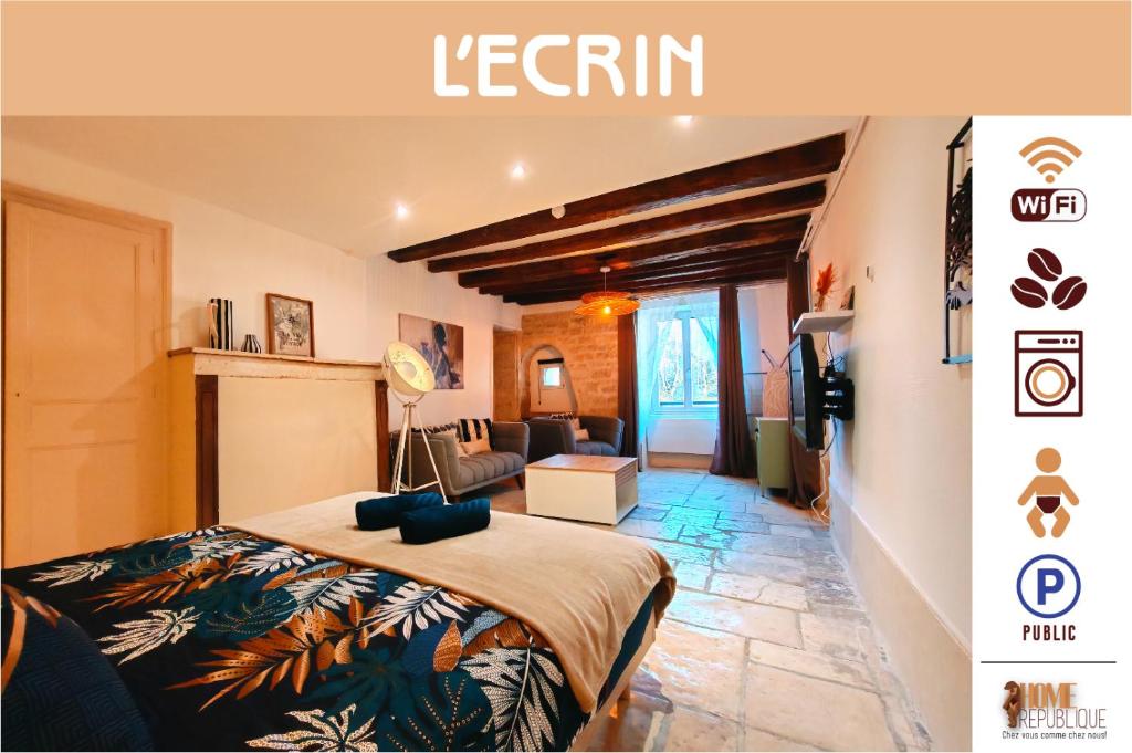 a bedroom with a bed and a living room at L'écrin - Chablis - Homerepublique- Plein centre - Élégant - Parking à proximité in Chablis
