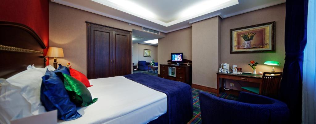 a hotel room with a bed and a desk at Merit Lefkosa Hotel & Casino in North Nicosia