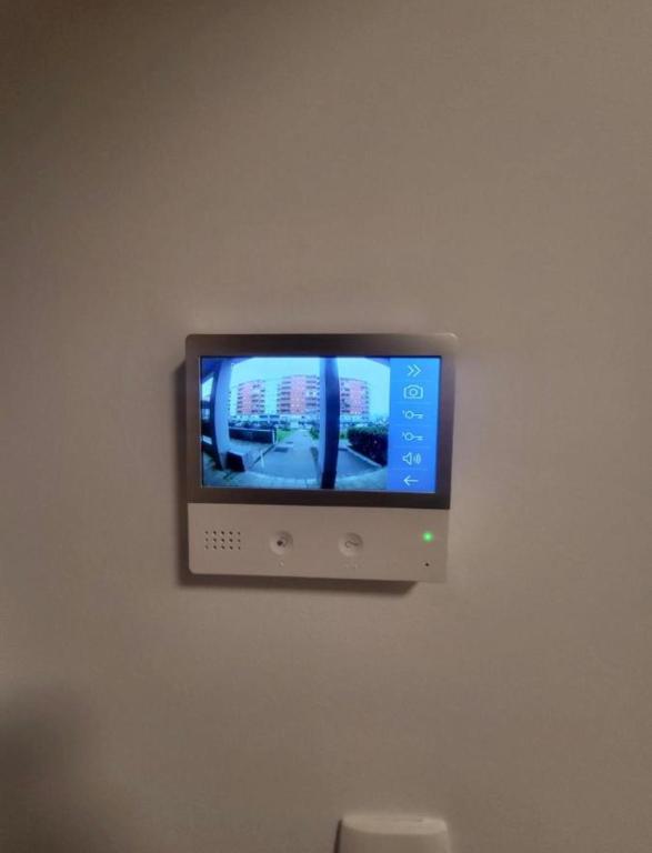 a flat screen tv on a wall at Master apartman in Podgorica