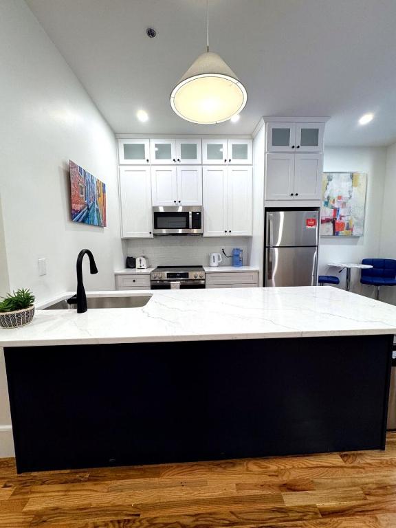a kitchen with a black and white counter top at Downtown Providence FREE parking in Providence