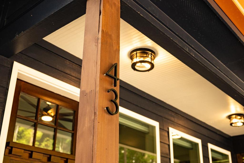 a front door of a house with a sign on it at Dual-Head Shower for Two-Romantic Retreat in Aerial