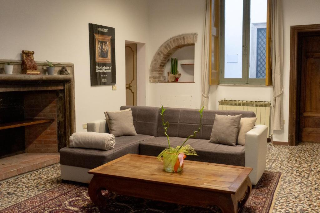 a living room with a couch and a coffee table at Palazzo Marini in Spoleto