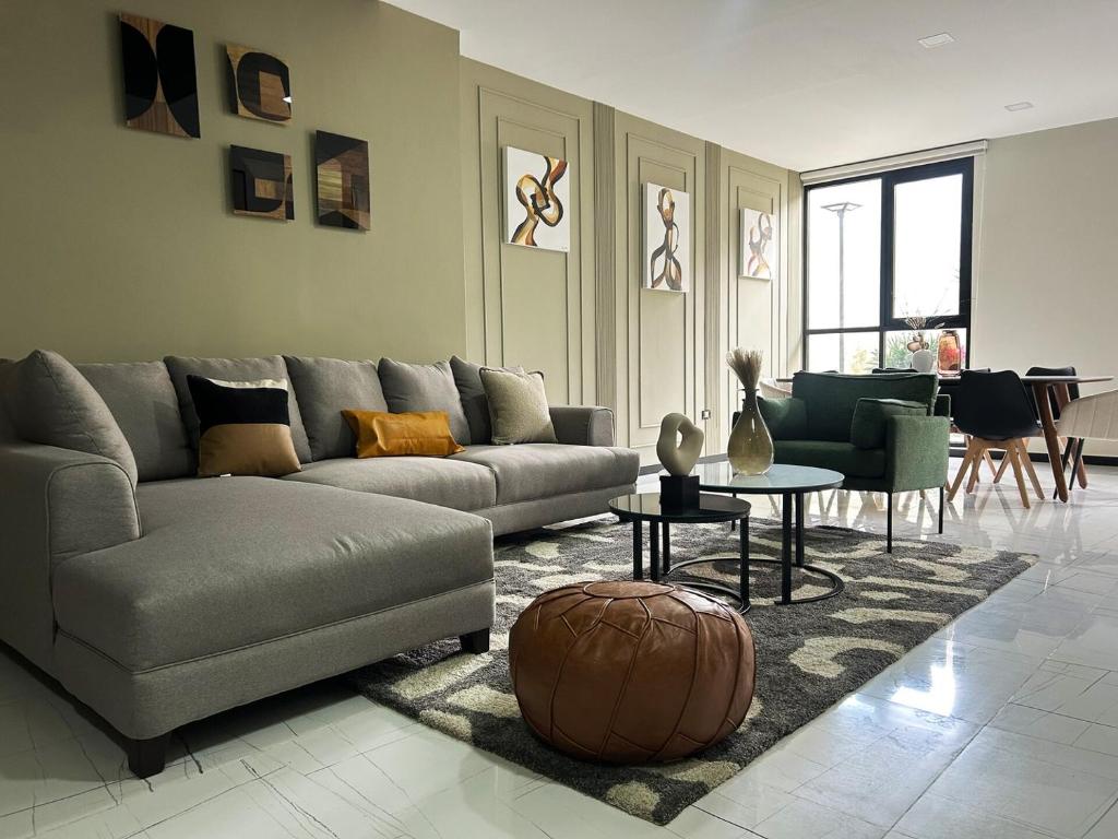 a living room with a couch and a table at Exclusive Apartment in Home Resort in La Cañada