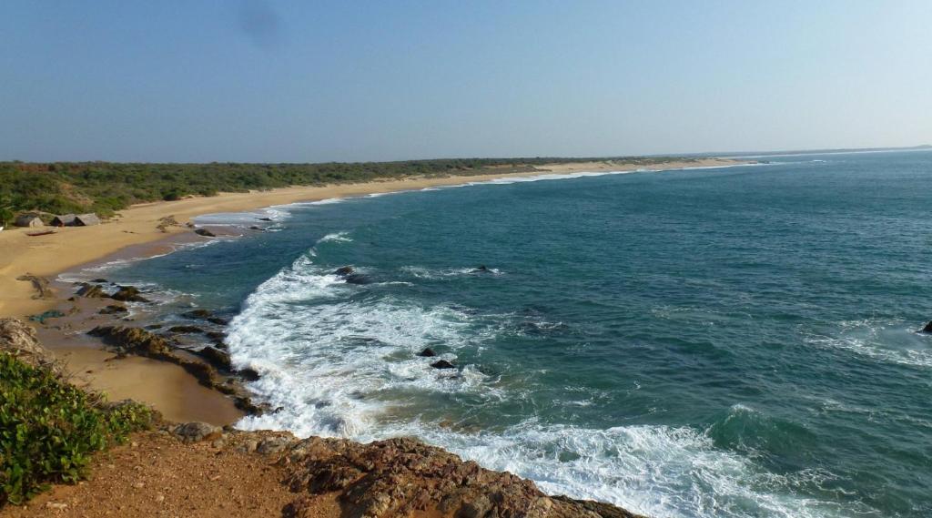an aerial view of a beach with the ocean at Samren Rest in Hambantota