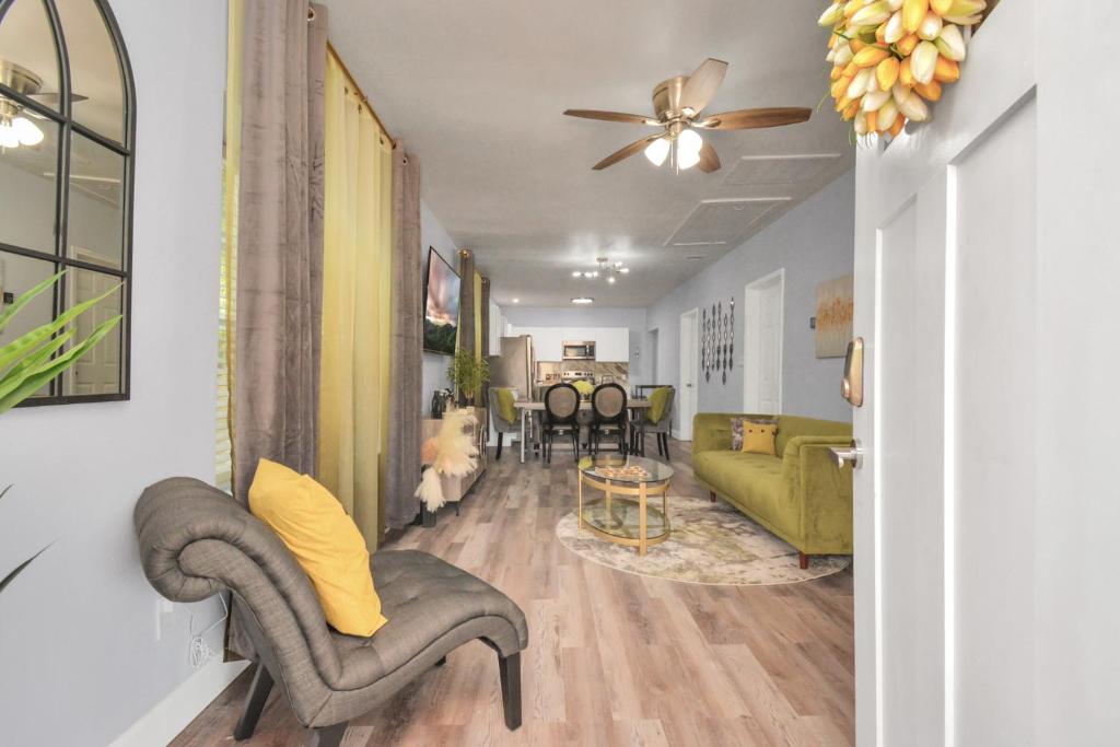 a living room with a couch and a table at 2 BR Cottage Midtown Downtown EADO in Houston