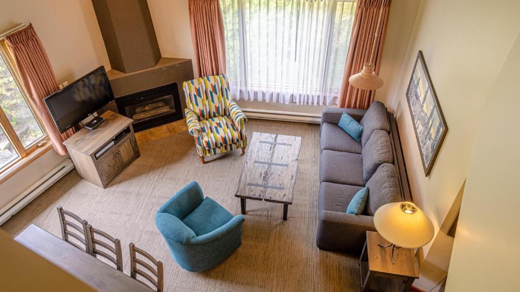 a living room with a couch and a tv at Cahilty #429 home in Sun Peaks