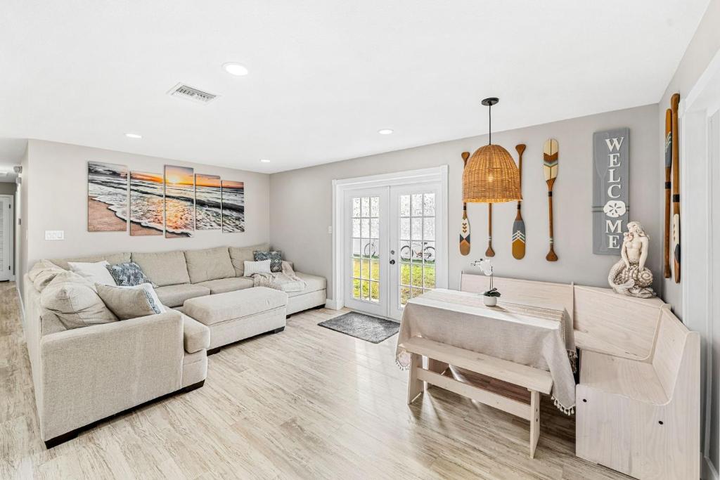 a living room with a couch and a table at 332 Formosa Drive in Cocoa Beach