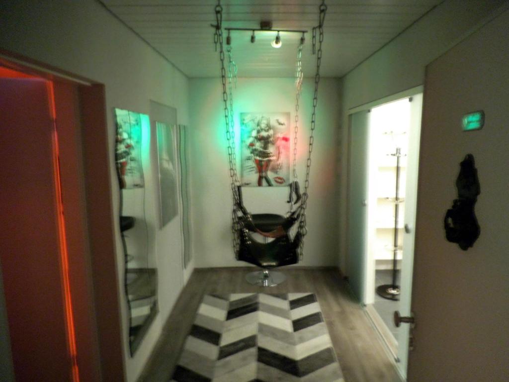 a room with a swing hanging from a wall at Exclusiv-Mietapartment (BDSM)-Heidelberg in Heidelberg