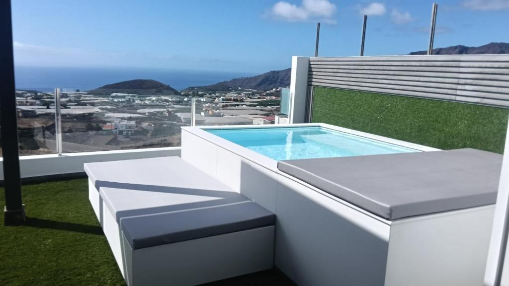 a swimming pool on the balcony of a house at Los Roquitos II in El Paso