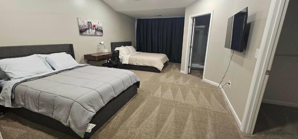 a hotel room with a bed and a television at Townhome in Ranson, WV in Ranson
