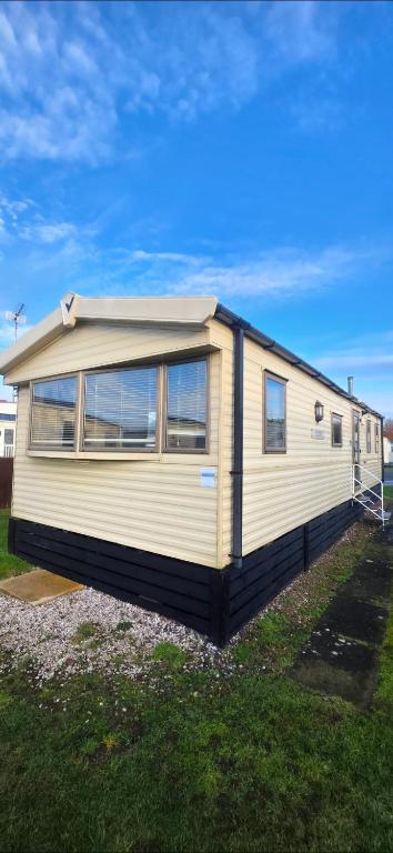 a mobile home is parked in a field at Vanhalla in Heysham