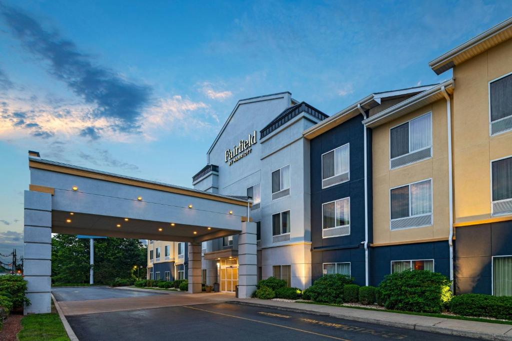 a rendering of a hotel with a parking garage at Fairfield Inn & Suites by Marriott Edison - South Plainfield in Edison