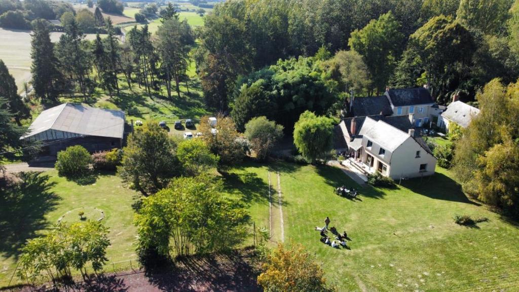 an aerial view of a house and a farm at Le Moulin de Crampaux in Mansigné