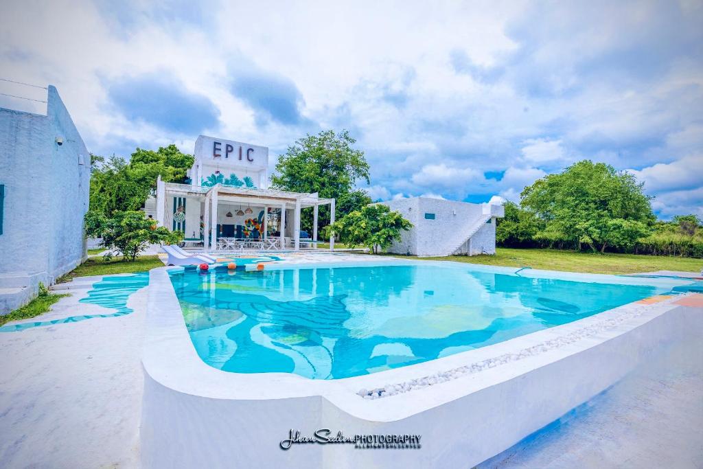 a large swimming pool in front of a building at Epic Wild Wilpattu in Nochchiyagama