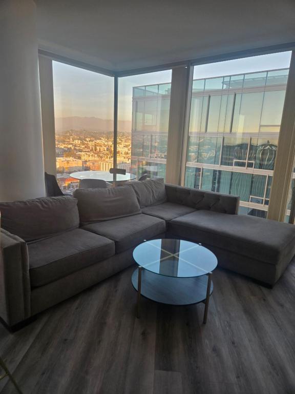 a living room with a couch and a glass table at 2 Bedroom with City Views in Los Angeles