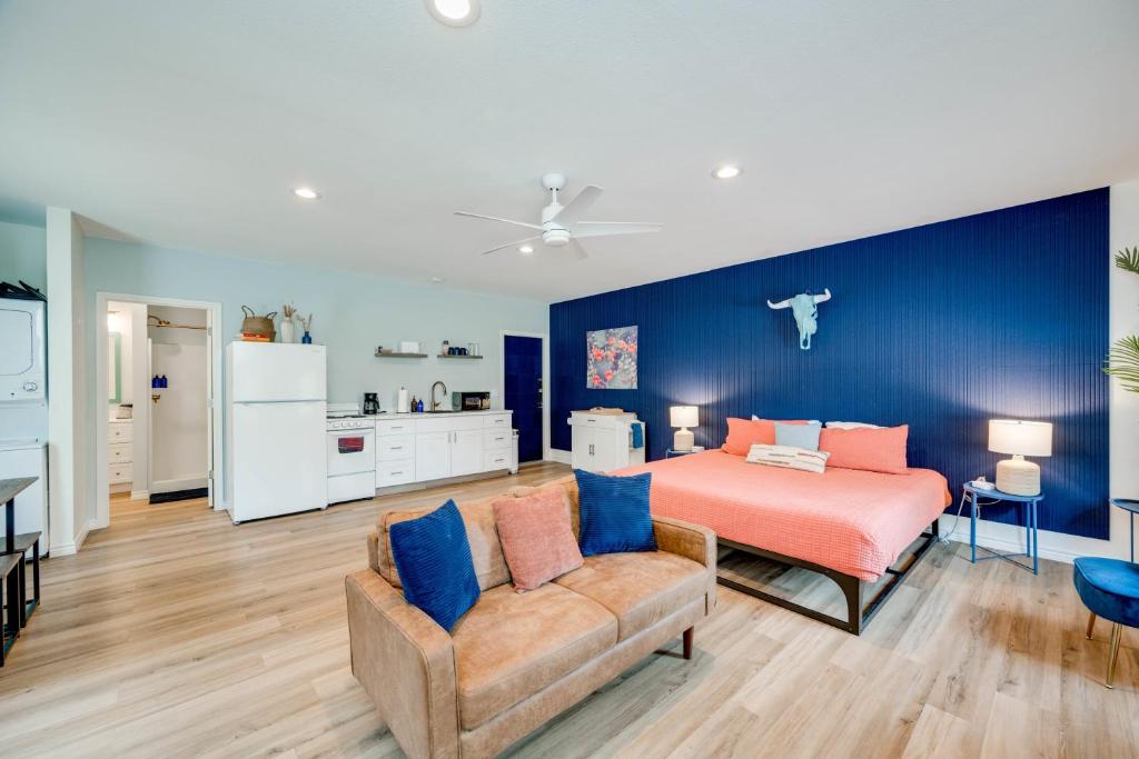 a bedroom with a bed and a couch at Ranchette Apartment- beach access small lake view in Buchanan Dam
