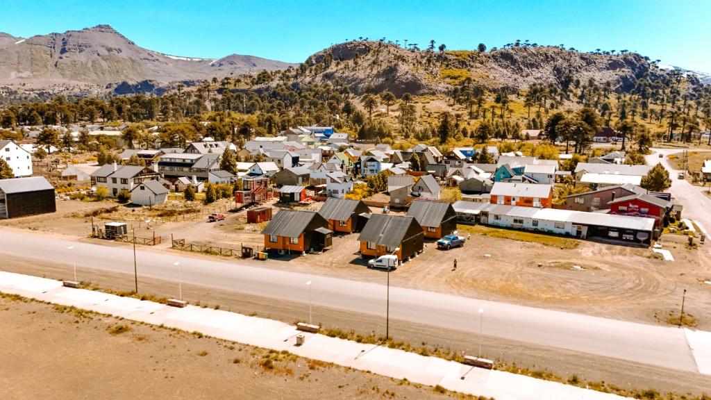 an aerial view of a small town next to a road at Cabañas Lihuen in Caviahue