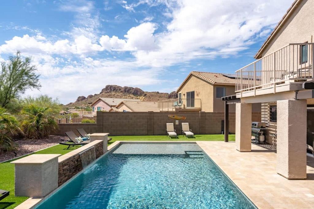 a swimming pool in the backyard of a house at Superstition Sunrise in Gold Canyon