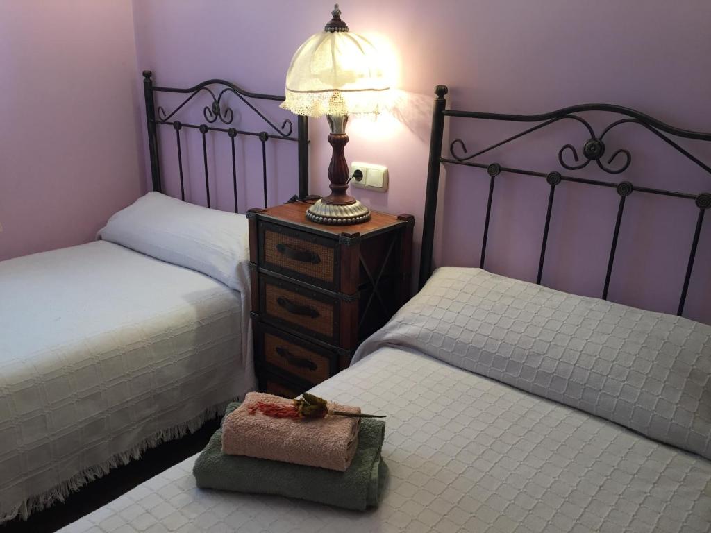A bed or beds in a room at Fuente de Cella