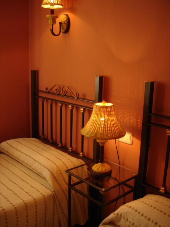 A bed or beds in a room at Fuente de Cella
