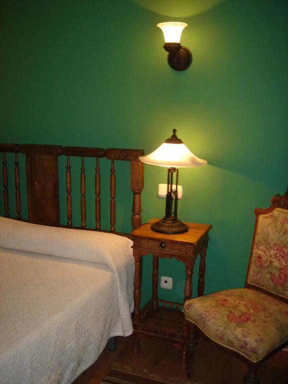 A bed or beds in a room at Fuente de Cella